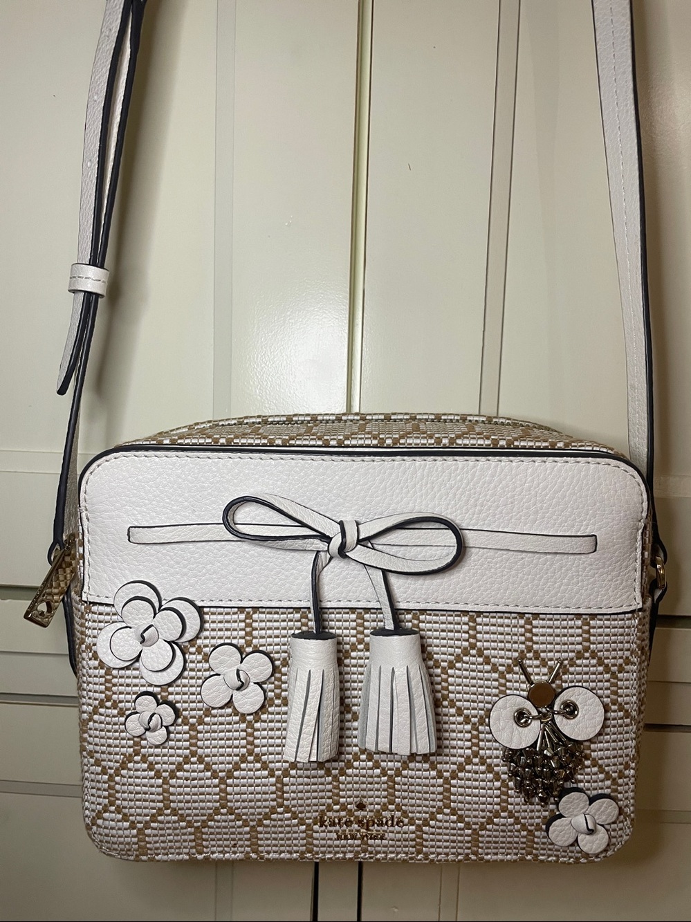 Kate Spade New York Hayes Leather Bee Embellished Camera Bag in White and Tan.
